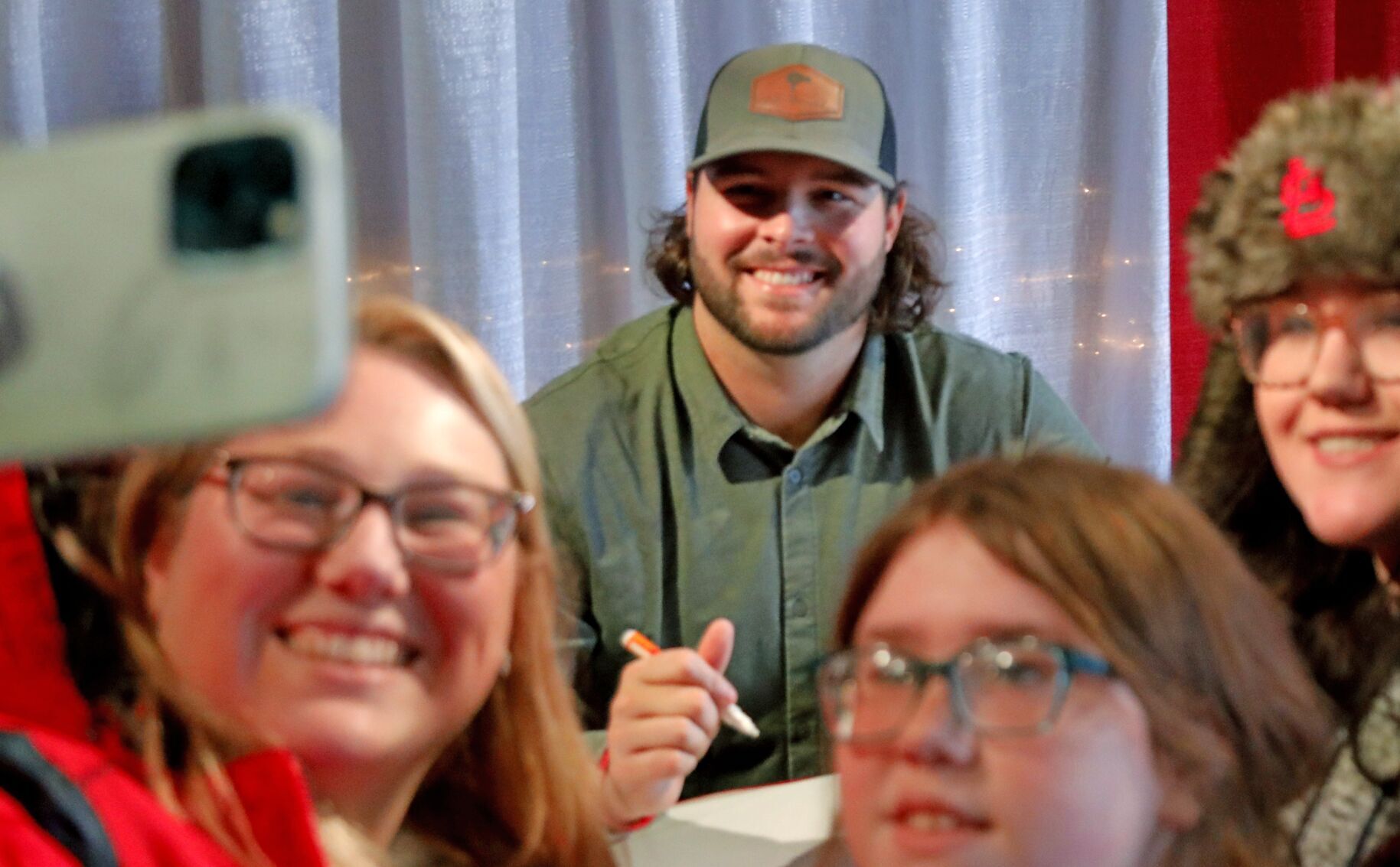 St. Louis Cardinals outfielder Alec Burleson signs autographs